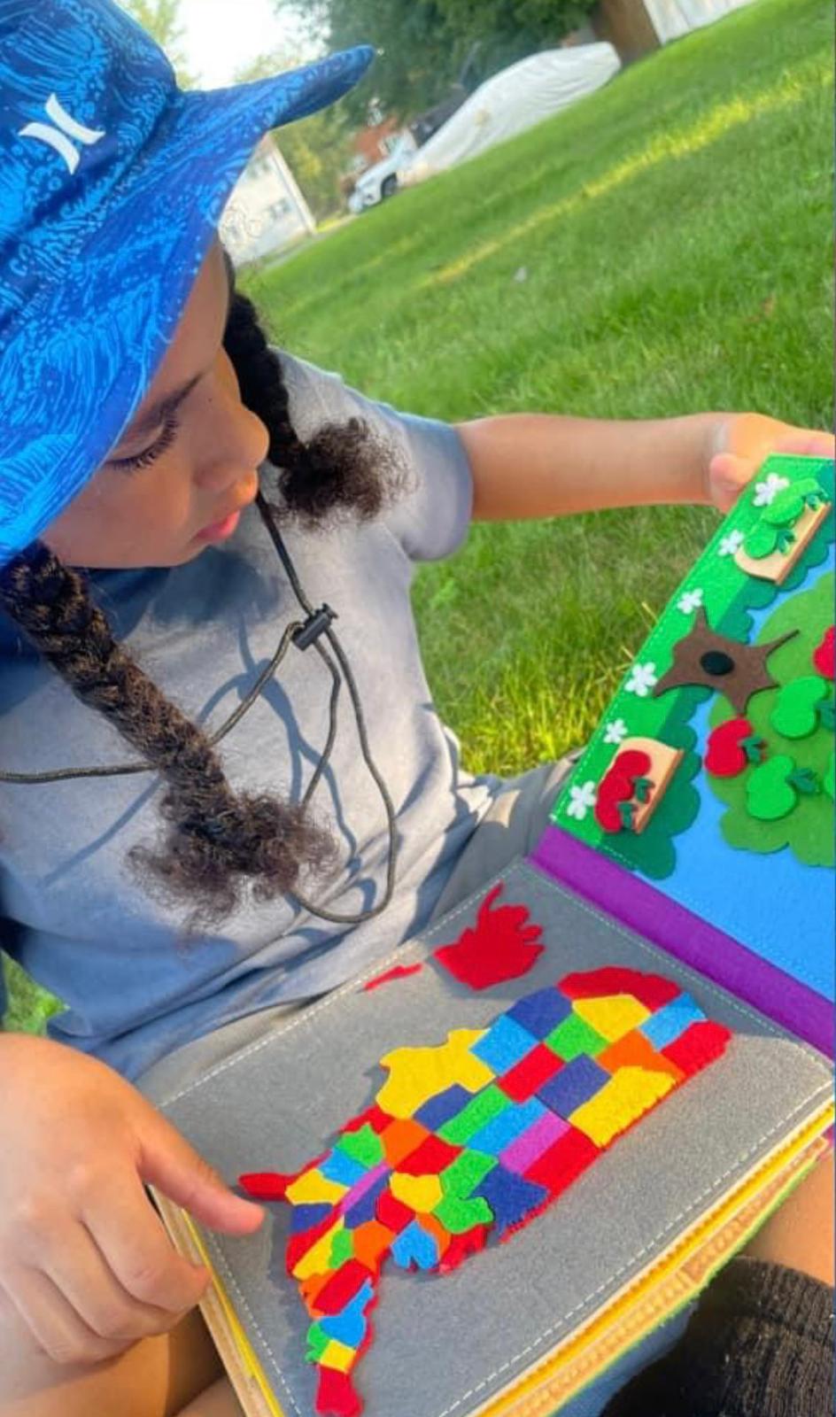 Valé Learn and Play | Child Playing with Book